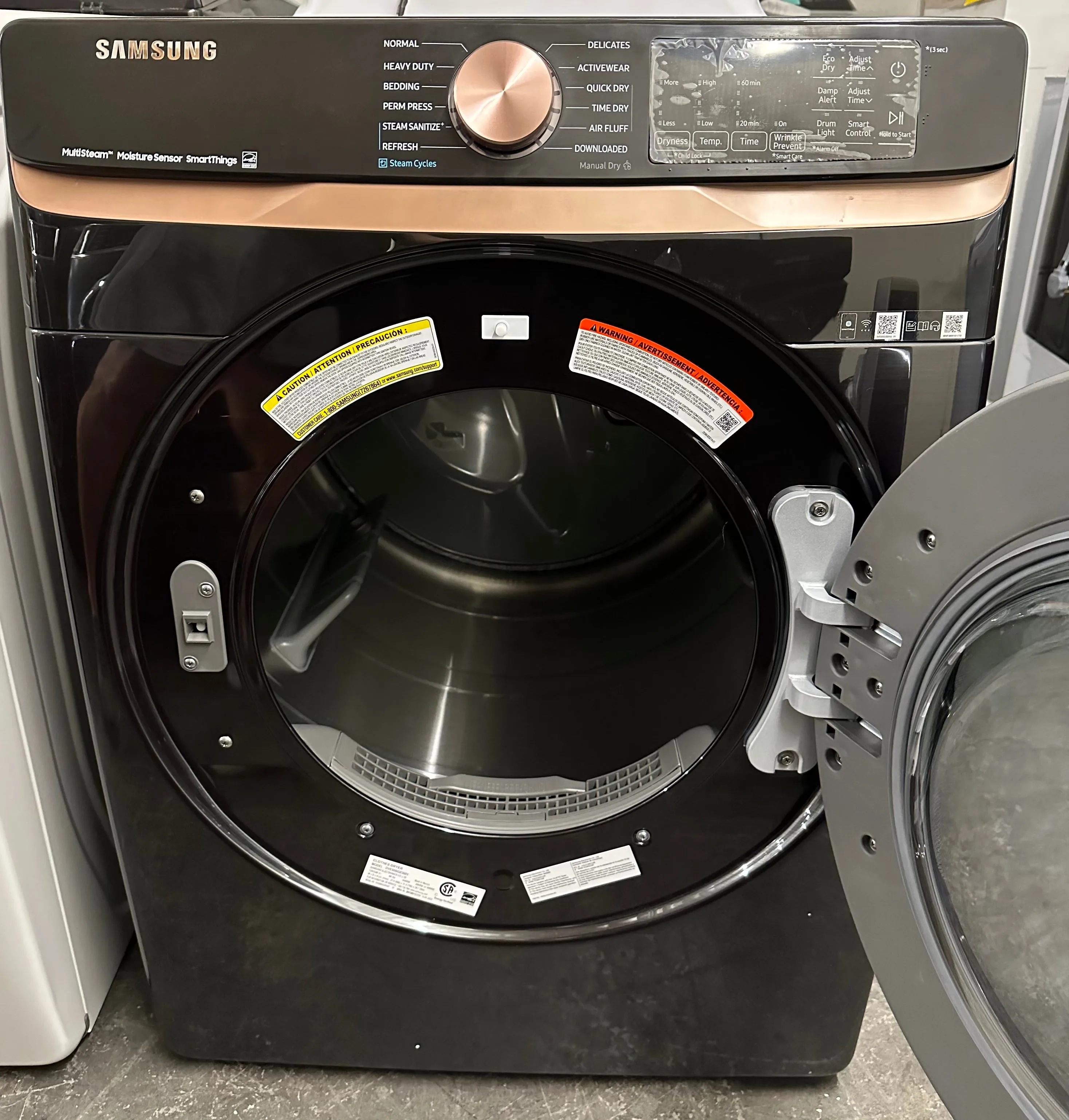 Samsung DVE50BG8300V 27 Inch Electric Dryer with 7.5 cu. ft. Capacity, Steam Sanitize , Sensor Dry, Vent Sensor, Smart Care, Wi-Fi, 21 Drying Cycles, Quick Dry, Wrinkle Prevent, ADA Compliant, and ENERGY STAR® Certified: Brushed Black